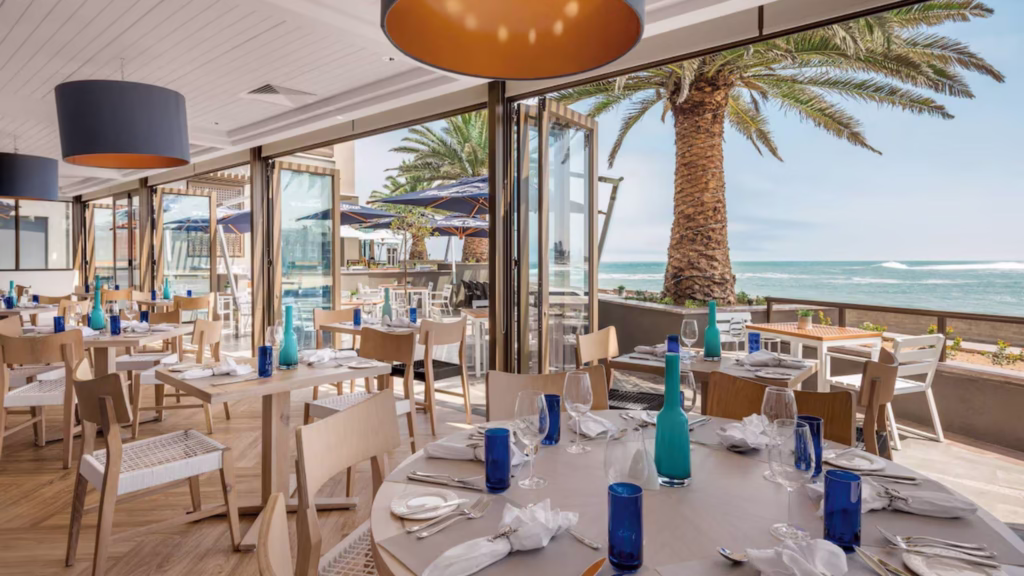 Interior with ocean views at one of the Strand Hotel's restaurants in Swakopmund, Namibia.